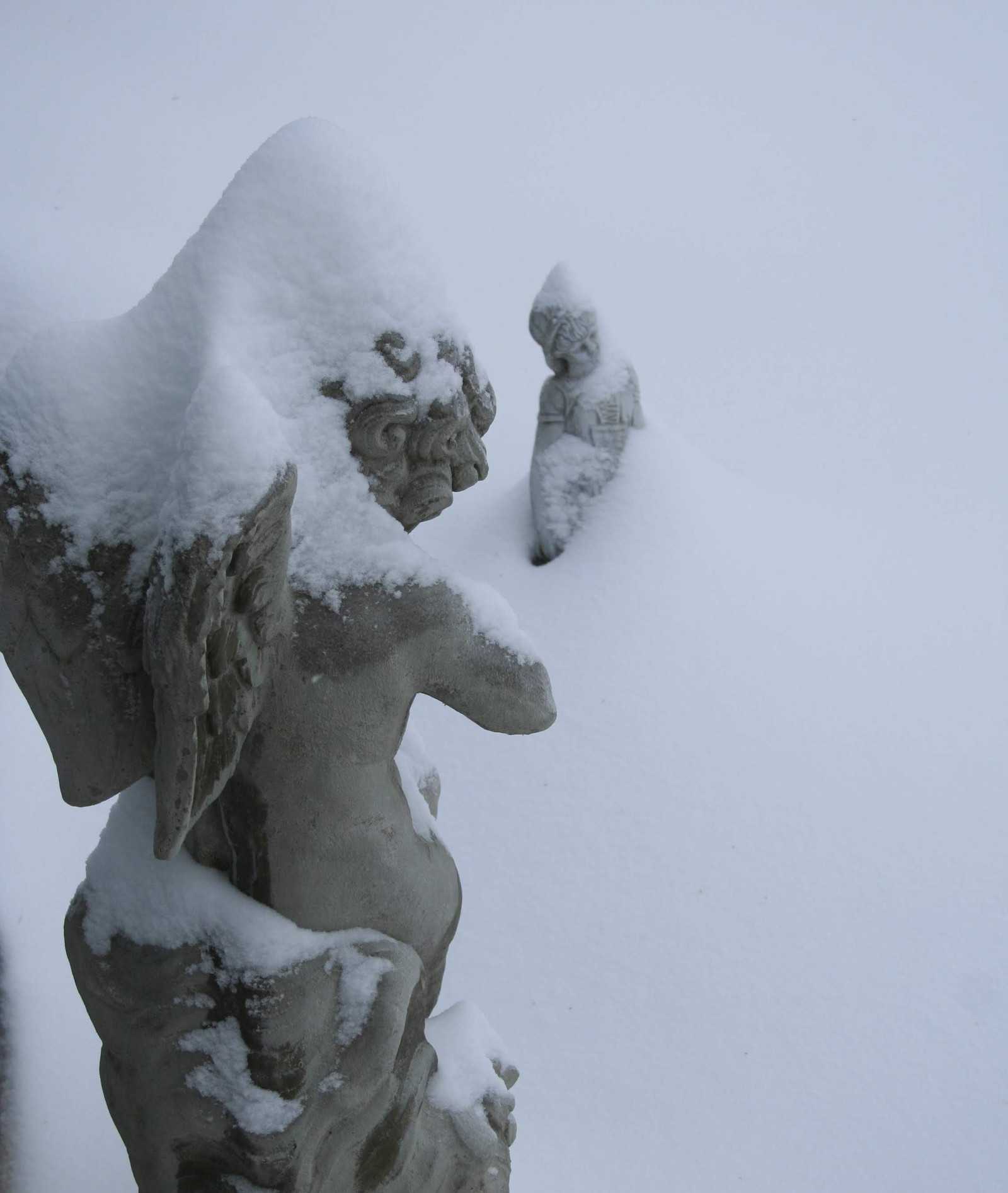 Snow covered statues